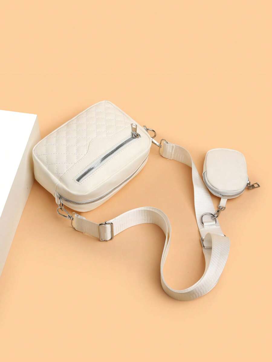 sacoche homme blanche motif avec petite sacoche sur le sol sangle grande et reglable